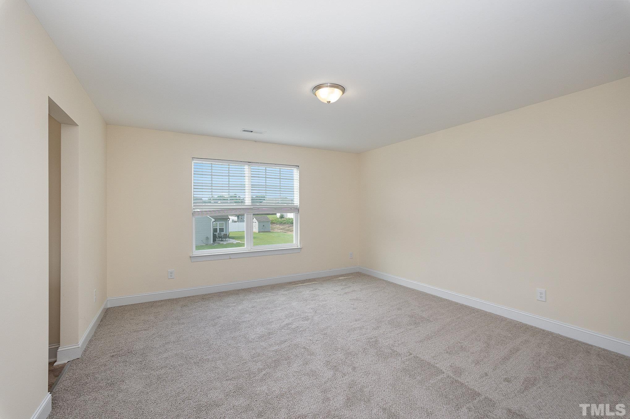 1513 Slate Ridge Road Knightdale, NC 27545 - Photo 25 of 36 an empty room with windows