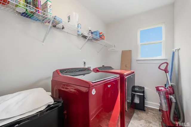 a view of a patio with table and chairs and potted plants