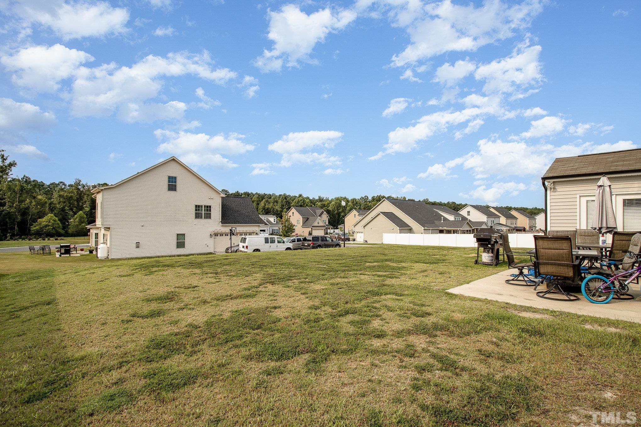 1513 Slate Ridge Road Knightdale, NC 27545 - Photo 34 of 36 a view of a house with a yard