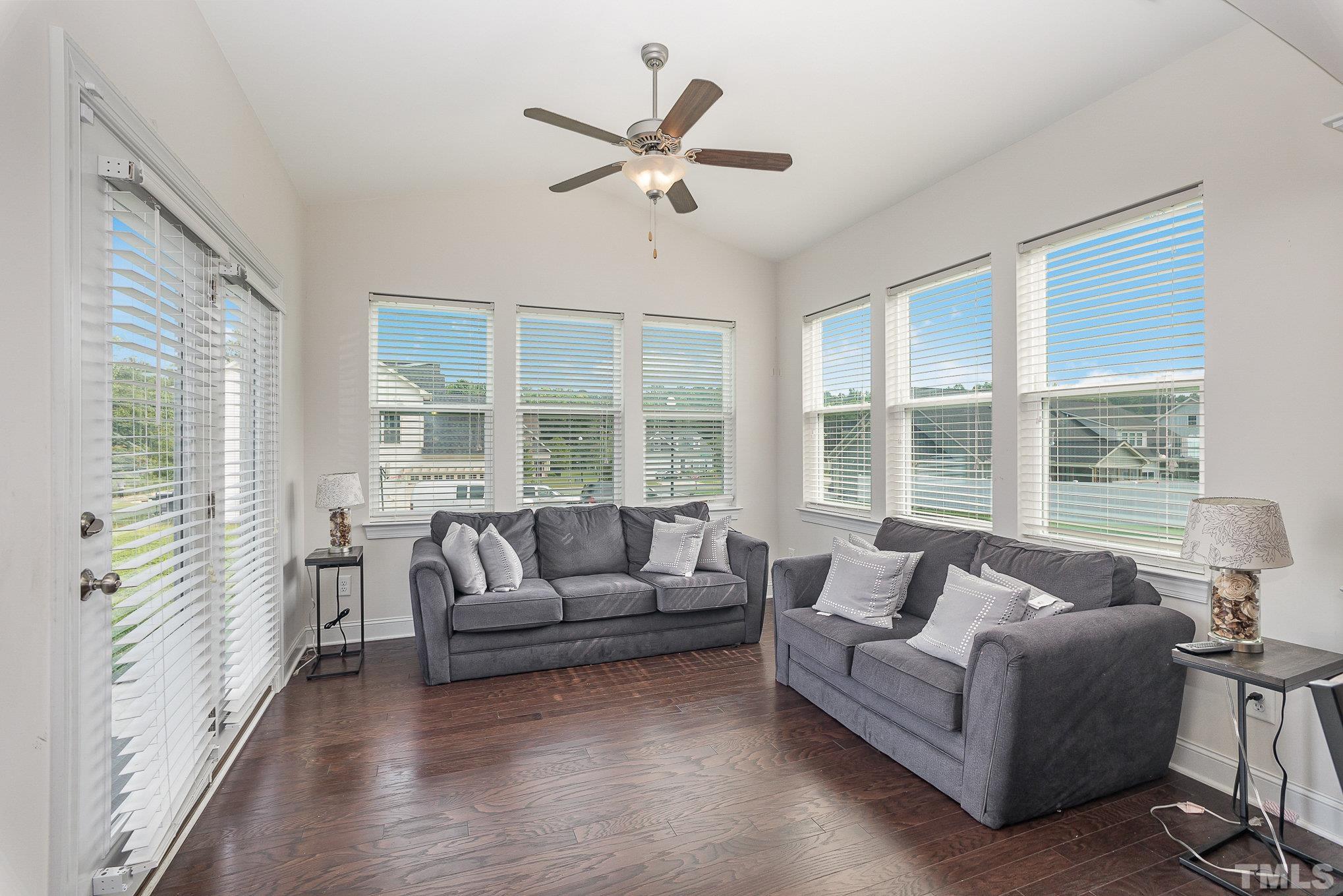 1513 Slate Ridge Road Knightdale, NC 27545 - Photo 6 of 36 a living room with furniture and floor to ceiling windows
