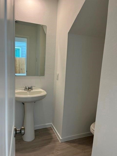 931 Pertuso Lane Huffman, TX 77336 - Photo 3 of 12 a bathroom with a sink and mirror