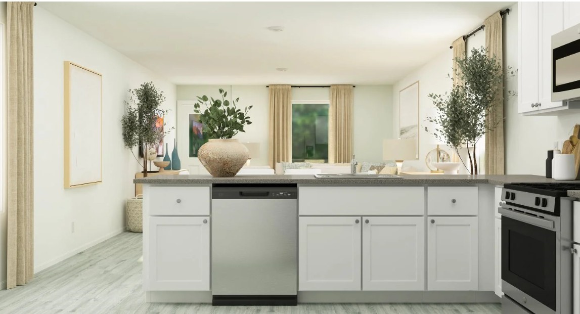 931 Pertuso Lane Huffman, TX 77336 - Photo 8 of 12 a kitchen with white cabinets and sink