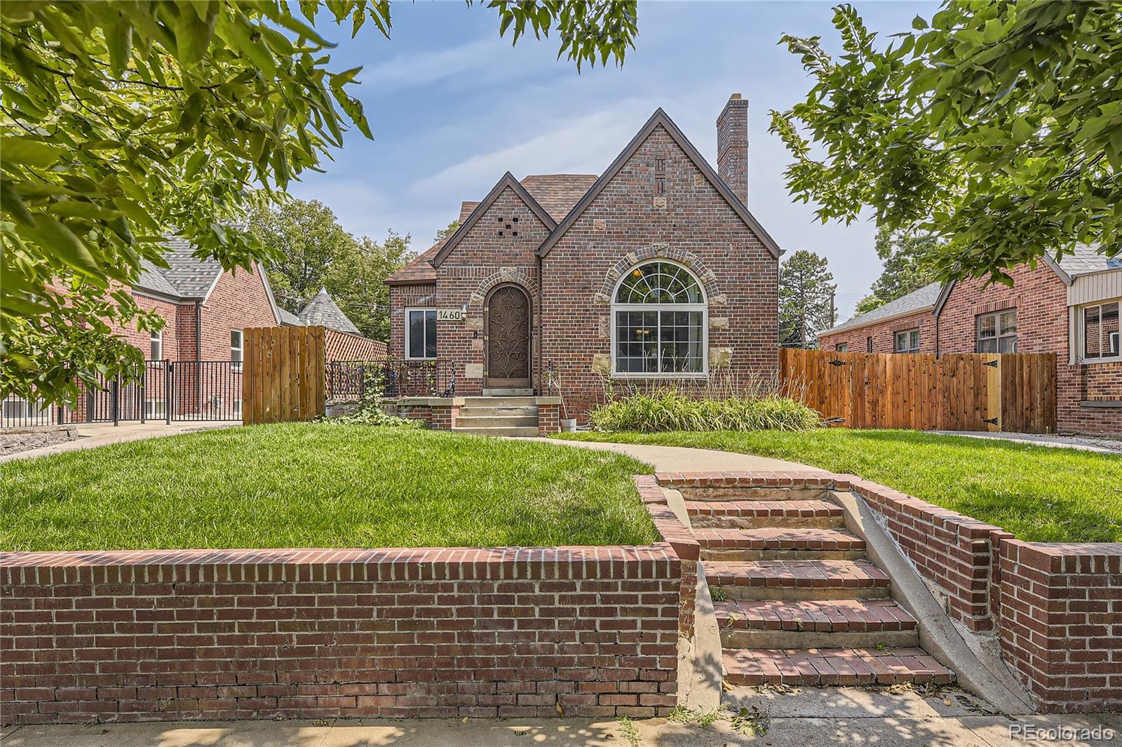 1460 Tennyson Street Denver, CO 80204 - Photo 1 of 44 a front view of a house with a yard
