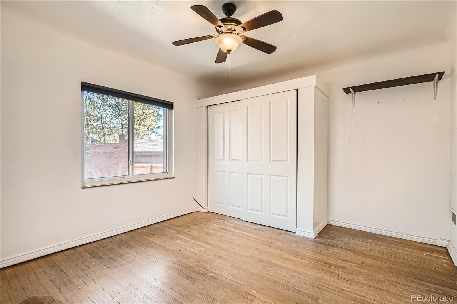 1460 Tennyson Street Denver, CO 80204 - Photo 13 of 44 a view of a livingroom with a window and wooden floor