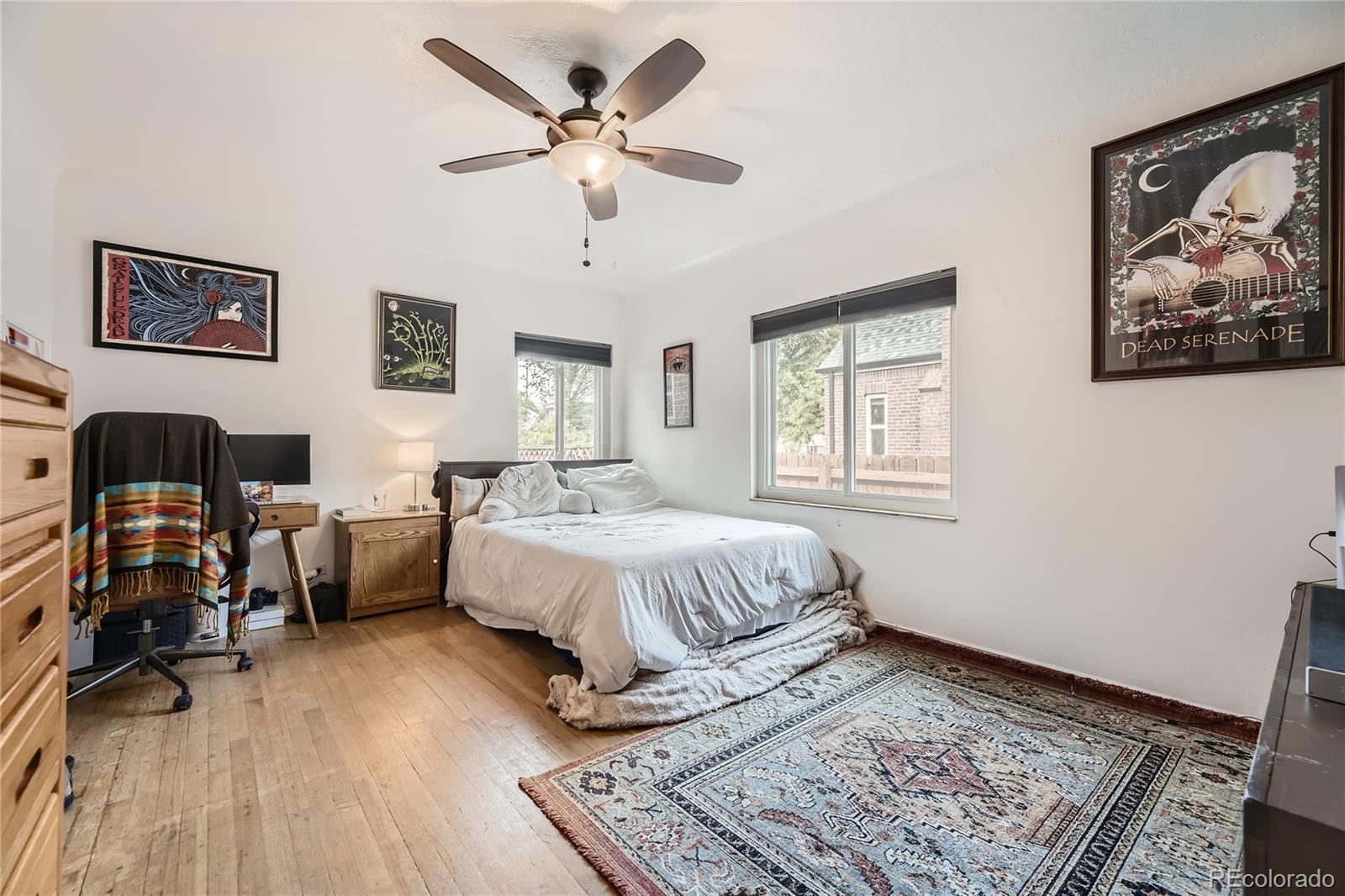 1460 Tennyson Street Denver, CO 80204 - Photo 15 of 44 a spacious bedroom with a large bed and a window