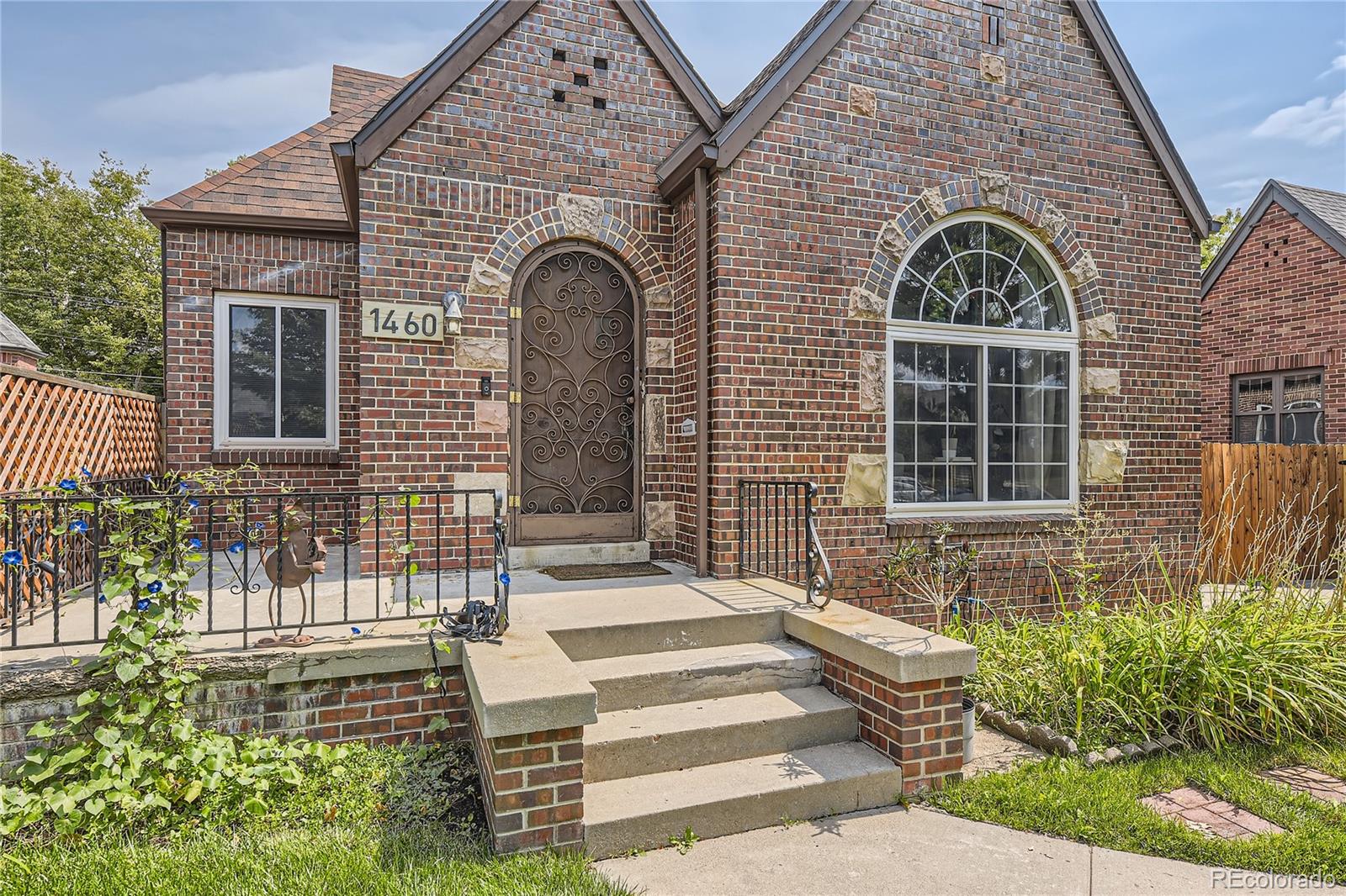 1460 Tennyson Street Denver, CO 80204 - Photo 2 of 44 a front view of a house with a garden