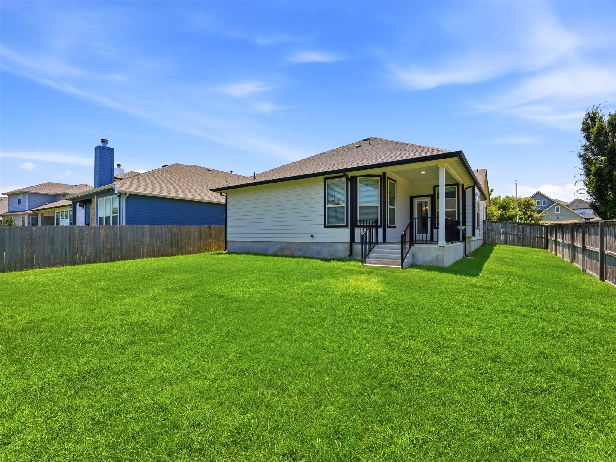 2132 Ringstaff Road Leander, TX 78641 - Photo 36 of 39 A spacious, verdant yard provides ample outdoor living space behind the charming residence.