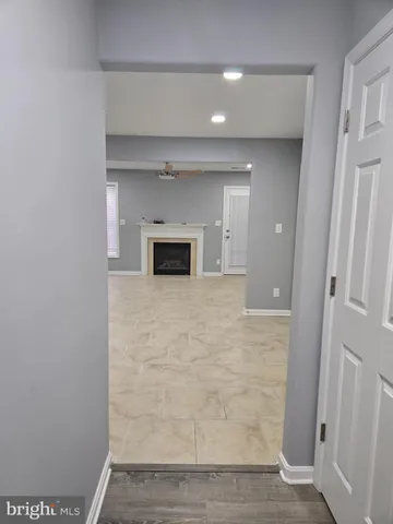 a view of empty room with a fireplace