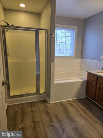 a bathroom with a bathtub and a shower