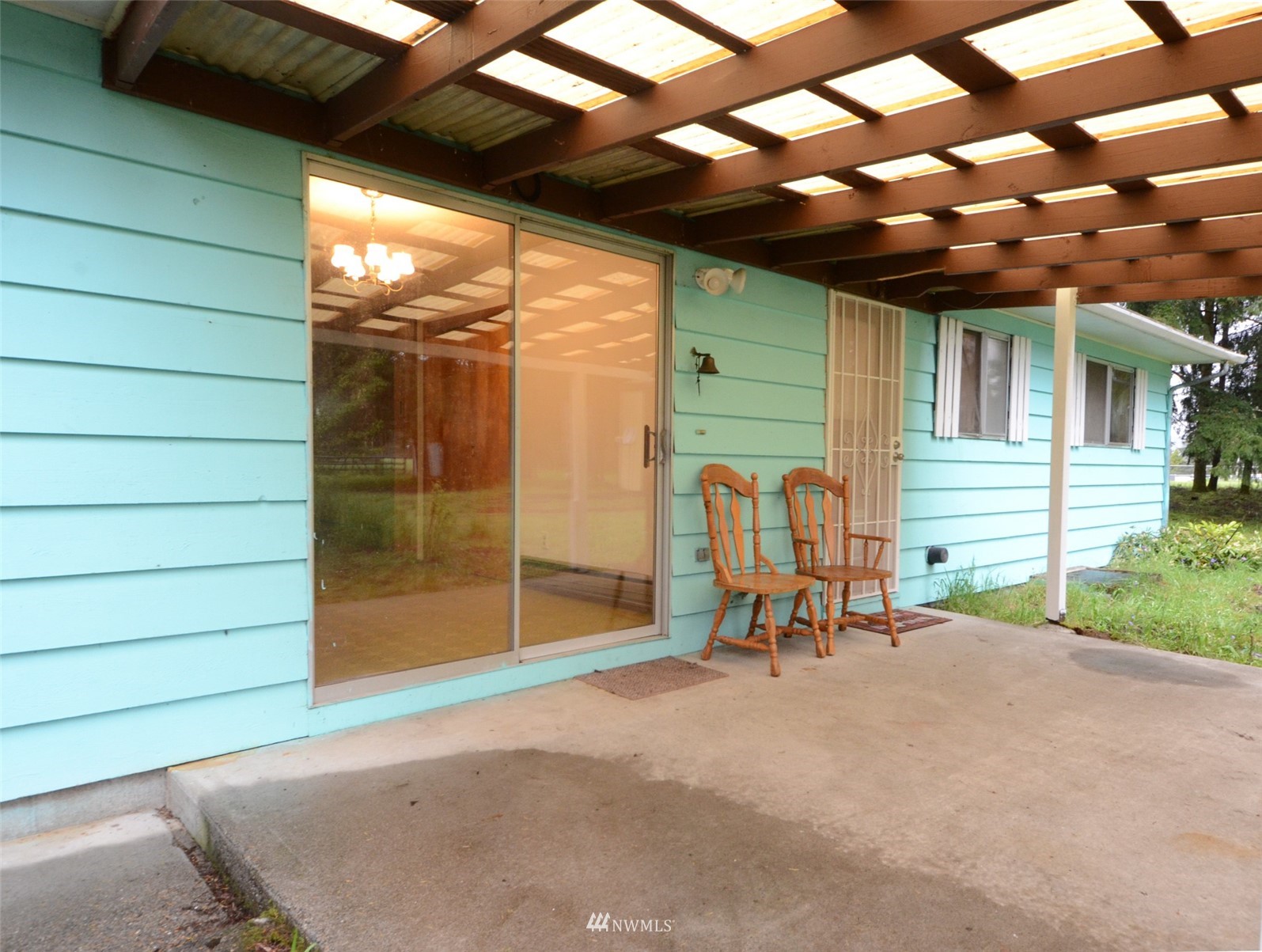18524 Guava Street Southwest Rochester, WA 98579 - Photo 11 of 28 a view of a porch with a table and chairs