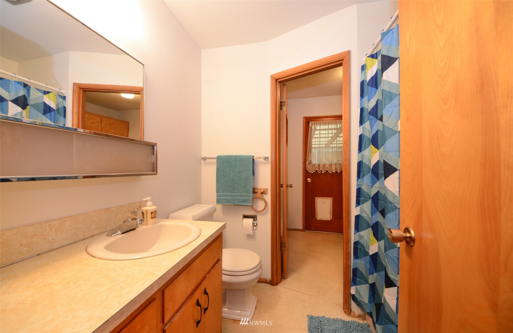 18524 Guava Street Southwest Rochester, WA 98579 - Photo 16 of 28 a bathroom with a sink and a mirror