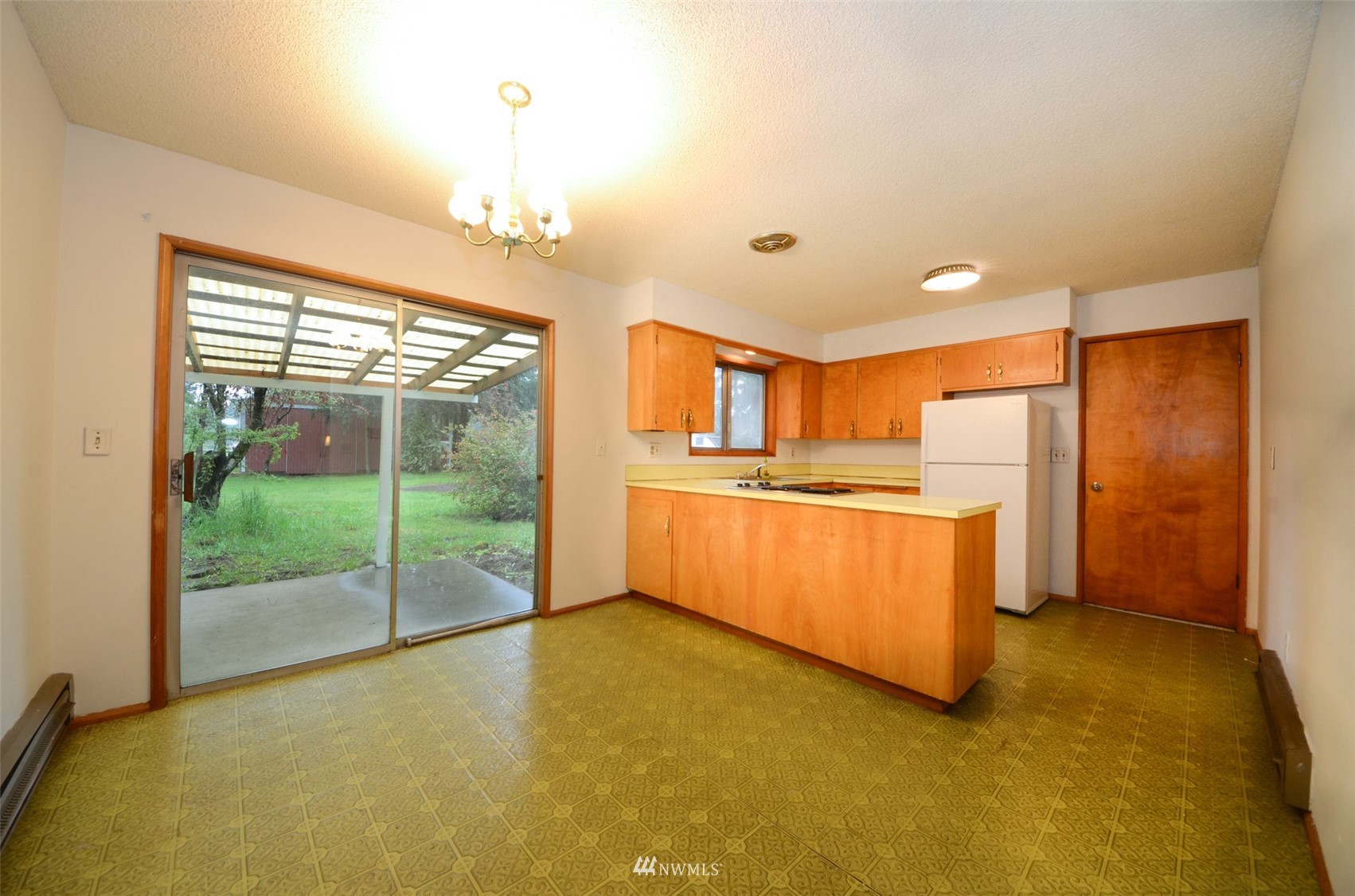 18524 Guava Street Southwest Rochester, WA 98579 - Photo 10 of 28 a view of kitchen with furniture and large window