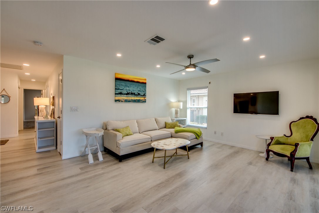 5585 Buring Court Fort Myers, FL 33919 - Photo 16 of 34 a living room with furniture and a flat screen tv