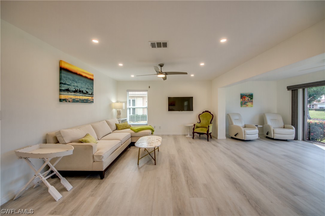 5585 Buring Court Fort Myers, FL 33919 - Photo 17 of 34 a living room with furniture and a table