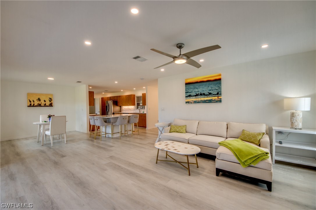 5585 Buring Court Fort Myers, FL 33919 - Photo 19 of 34 a living room with furniture and wooden floor