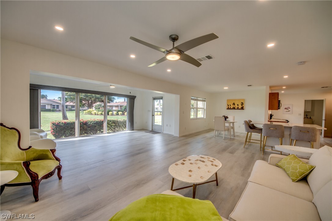 5585 Buring Court Fort Myers, FL 33919 - Photo 20 of 34 a living room with furniture and a large window
