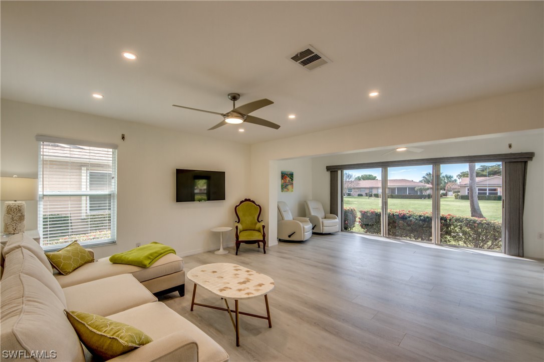 5585 Buring Court Fort Myers, FL 33919 - Photo 21 of 34 a living room with furniture and large windows