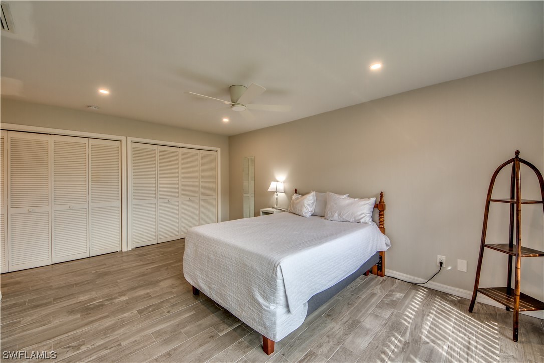 5585 Buring Court Fort Myers, FL 33919 - Photo 25 of 34 a bedroom with a bed and a mirror