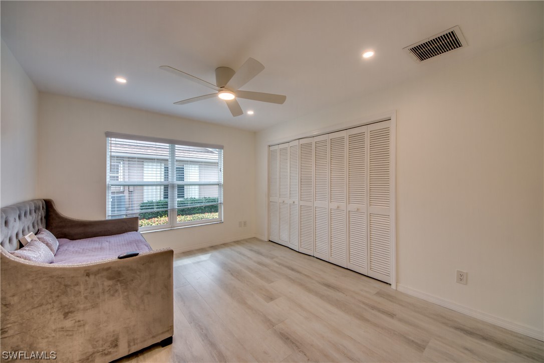 5585 Buring Court Fort Myers, FL 33919 - Photo 29 of 34 a living room with furniture and a large window