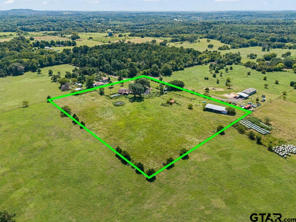 6404 Black Gum Road Gilmer, TX 75644 - Photo 26 of 45 an aerial view of a residential houses with outdoor space and trees