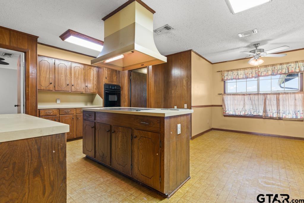 6404 Black Gum Road Gilmer, TX 75644 - Photo 8 of 45 a kitchen with a sink cabinets and window