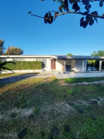 a view of a house with a big yard