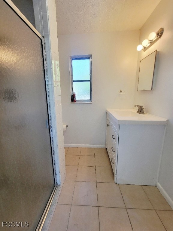 25 Maple Avenue North Lehigh Acres, FL 33936 - Photo 16 of 26 a bathroom with a sink a toilet and a mirror