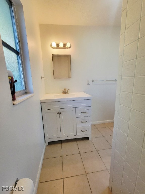 25 Maple Avenue North Lehigh Acres, FL 33936 - Photo 17 of 26 a bathroom with a sink a toilet and mirror