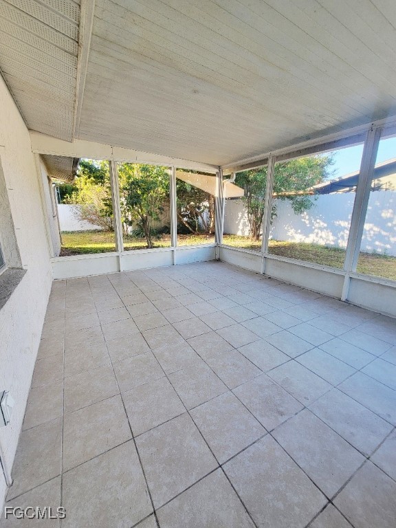 25 Maple Avenue North Lehigh Acres, FL 33936 - Photo 21 of 26 an empty room with floor to ceiling window and outdoor view