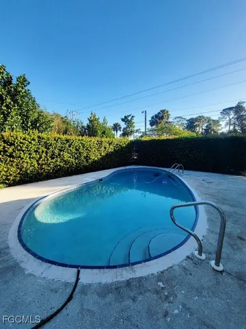 a view of a backyard with large trees