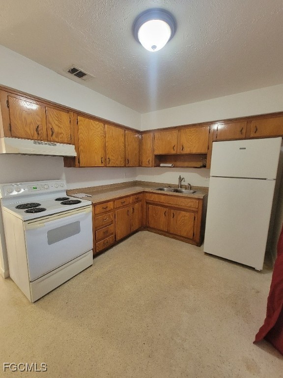 25 Maple Avenue North Lehigh Acres, FL 33936 - Photo 6 of 26 a kitchen with white cabinets and white appliances