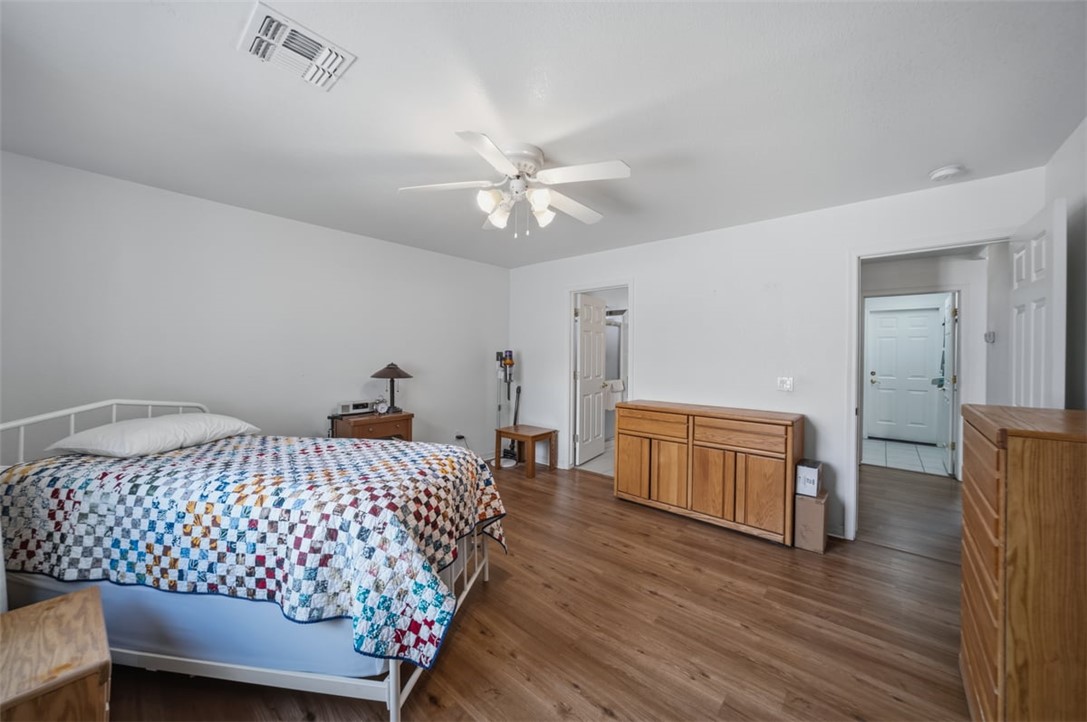 2144 Ridgeview Road Kingman, AZ 86401 - Photo 25 of 49 a bedroom with a bed and wooden floor