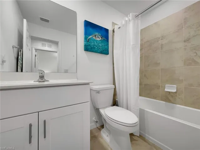 a bathroom with a toilet a sink and a bathtub