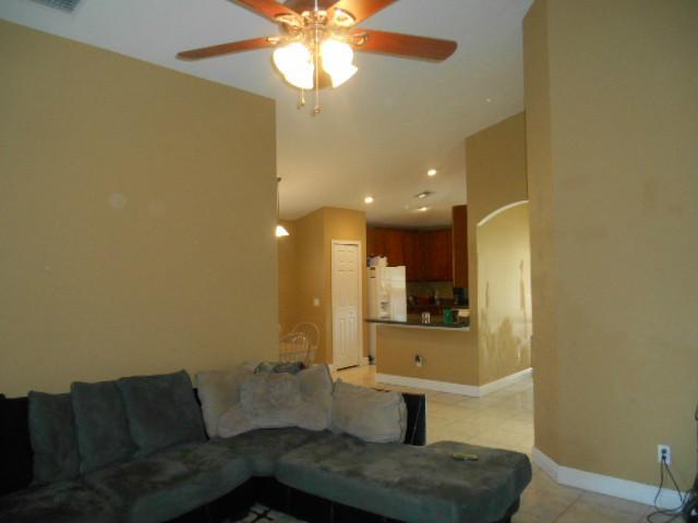 5780 Southeast Colee Avenue Stuart, FL 34997 - Photo 12 of 25 a bathroom with a sink and a mirror