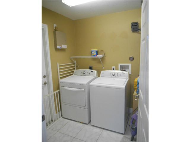 5780 Southeast Colee Avenue Stuart, FL 34997 - Photo 14 of 25 a utility room with dryer and washer