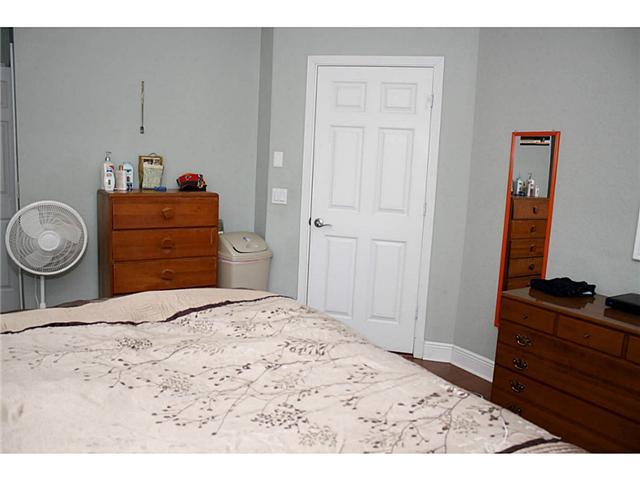 5780 Southeast Colee Avenue Stuart, FL 34997 - Photo 21 of 25 a bedroom with a bed and a dresser