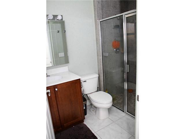 5780 Southeast Colee Avenue Stuart, FL 34997 - Photo 22 of 25 a bathroom with a toilet and a shower