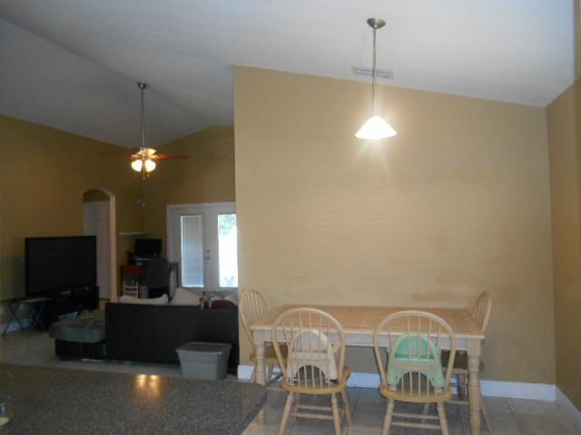 5780 Southeast Colee Avenue Stuart, FL 34997 - Photo 9 of 25 a view of a dining room with furniture and a chandelier