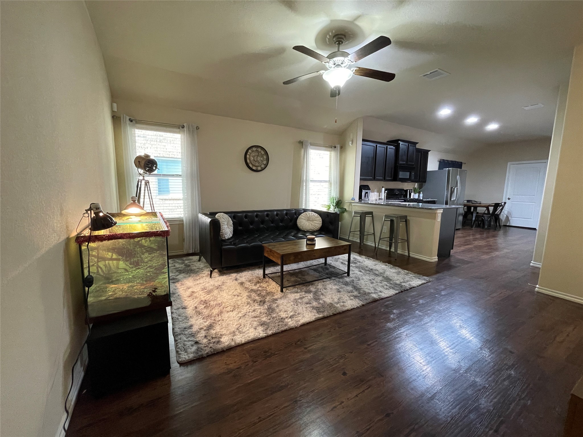 3650 Sumner Lodge Drive Katy, TX 77449 - Photo 11 of 41 a living room with furniture flat screen tv and kitchen view