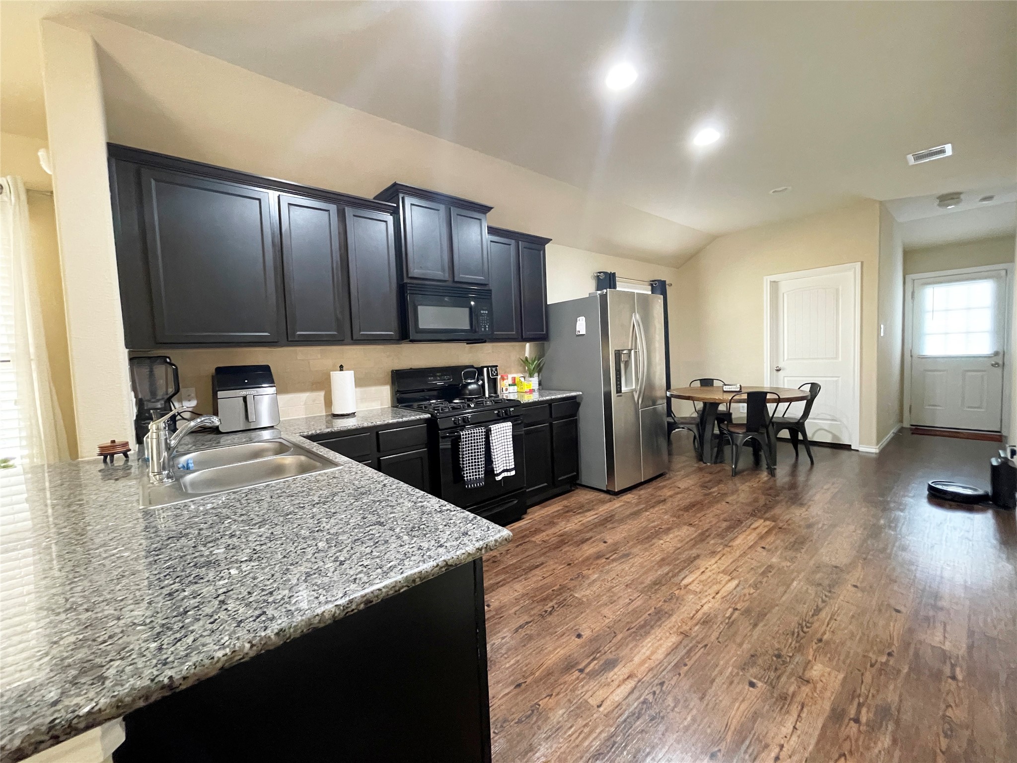 3650 Sumner Lodge Drive Katy, TX 77449 - Photo 19 of 41 a kitchen with counter top space cabinets and stainless steel appliances