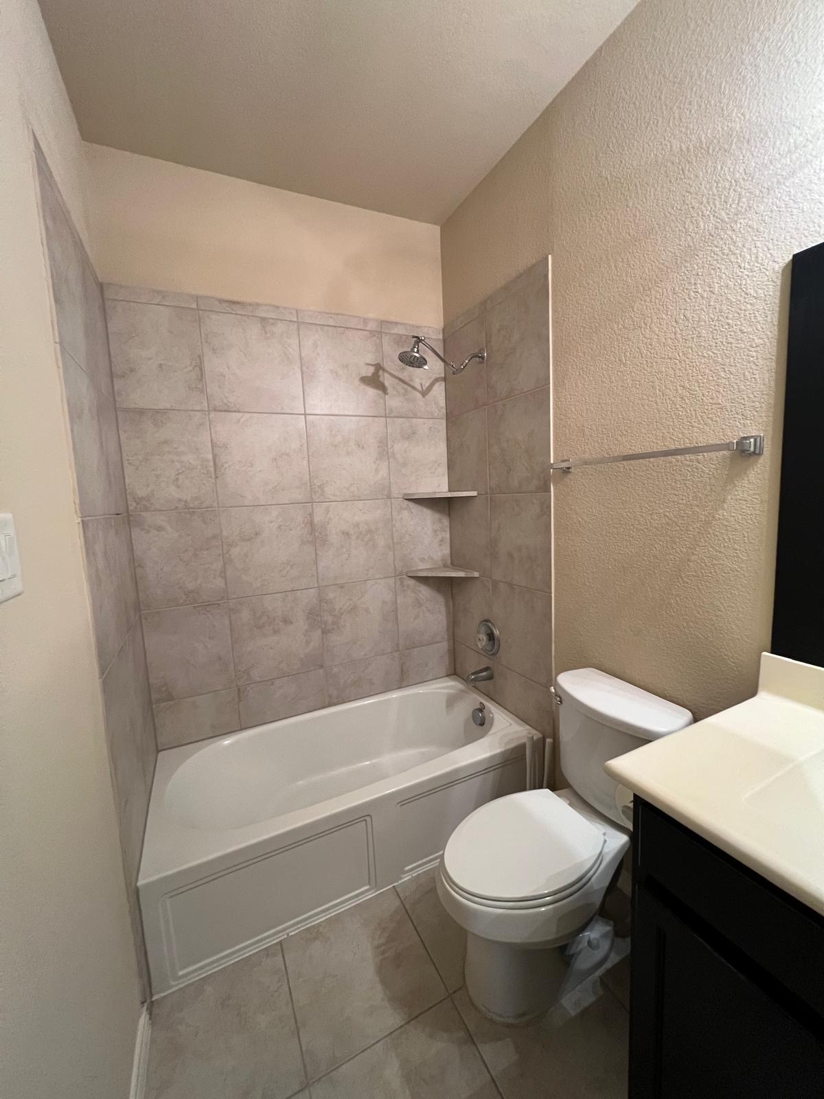 3650 Sumner Lodge Drive Katy, TX 77449 - Photo 25 of 41 a bathroom with a toilet a sink and bathtub