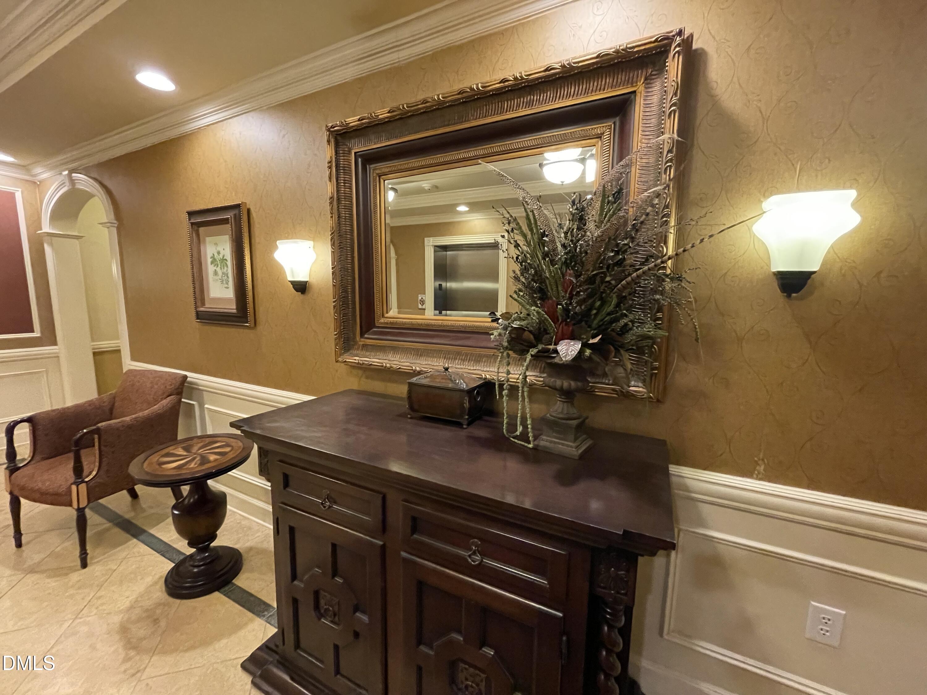 10411 Rosegate Court, Unit 3 Raleigh, NC 27617 - Photo 55 of 62 a bathroom with a sink a light fixture and a mirror