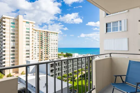 a view of balcony with furniture