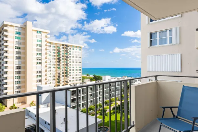 a view of balcony with furniture