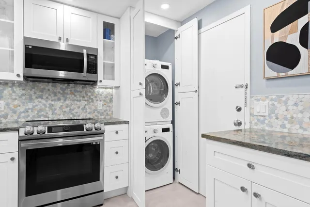 a kitchen with a stove and a microwave