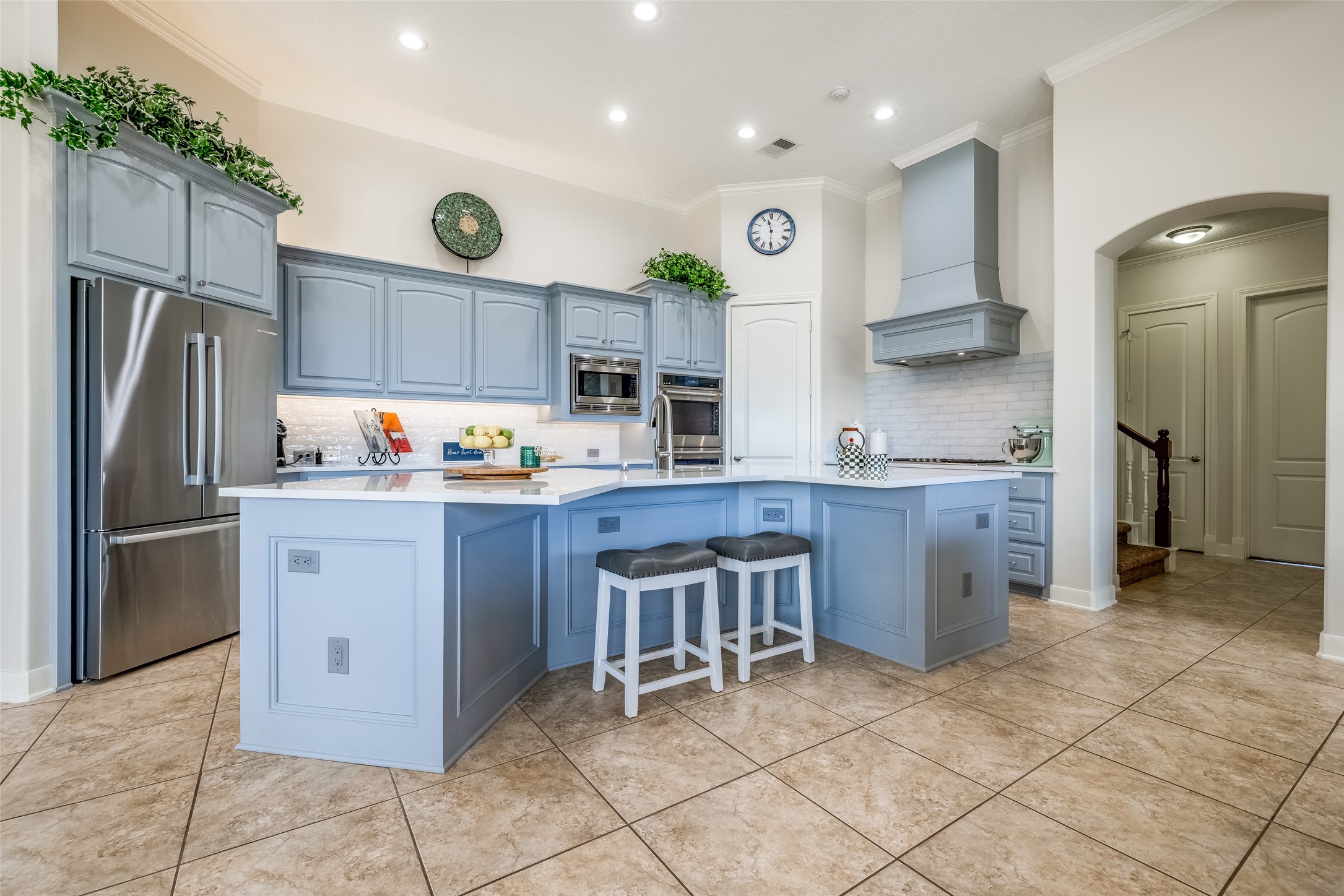 31102 Lower Oxbow Trace Fulshear, TX 77441 - Photo 11 of 50 a kitchen with a sink refrigerator and cabinets