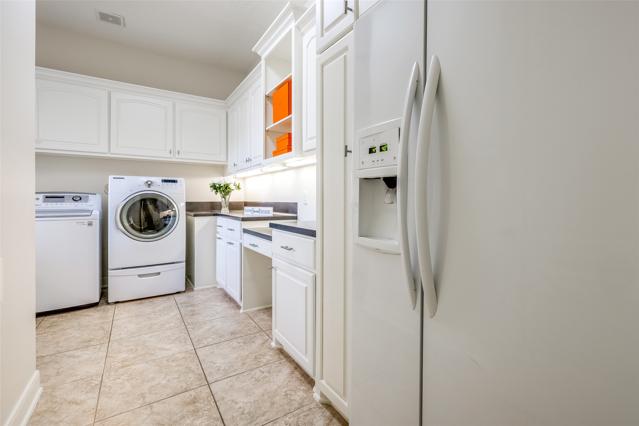 31102 Lower Oxbow Trace Fulshear, TX 77441 - Photo 31 of 50 a utility room with cabinets washer and dryer