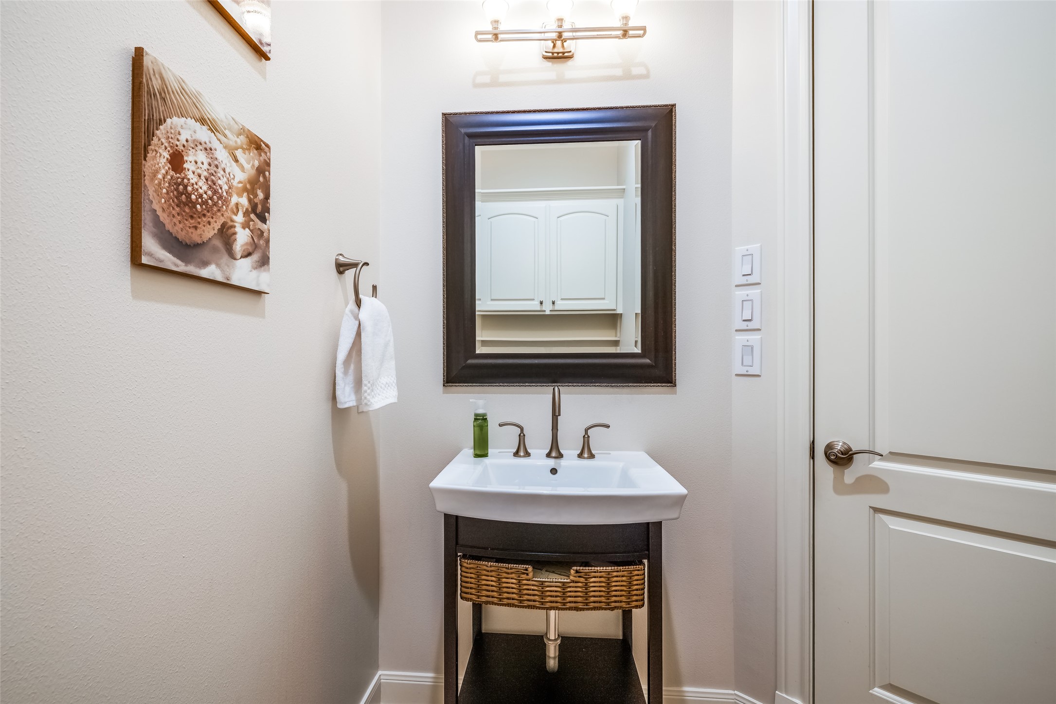 31102 Lower Oxbow Trace Fulshear, TX 77441 - Photo 33 of 50 a bathroom with a sink and a mirror