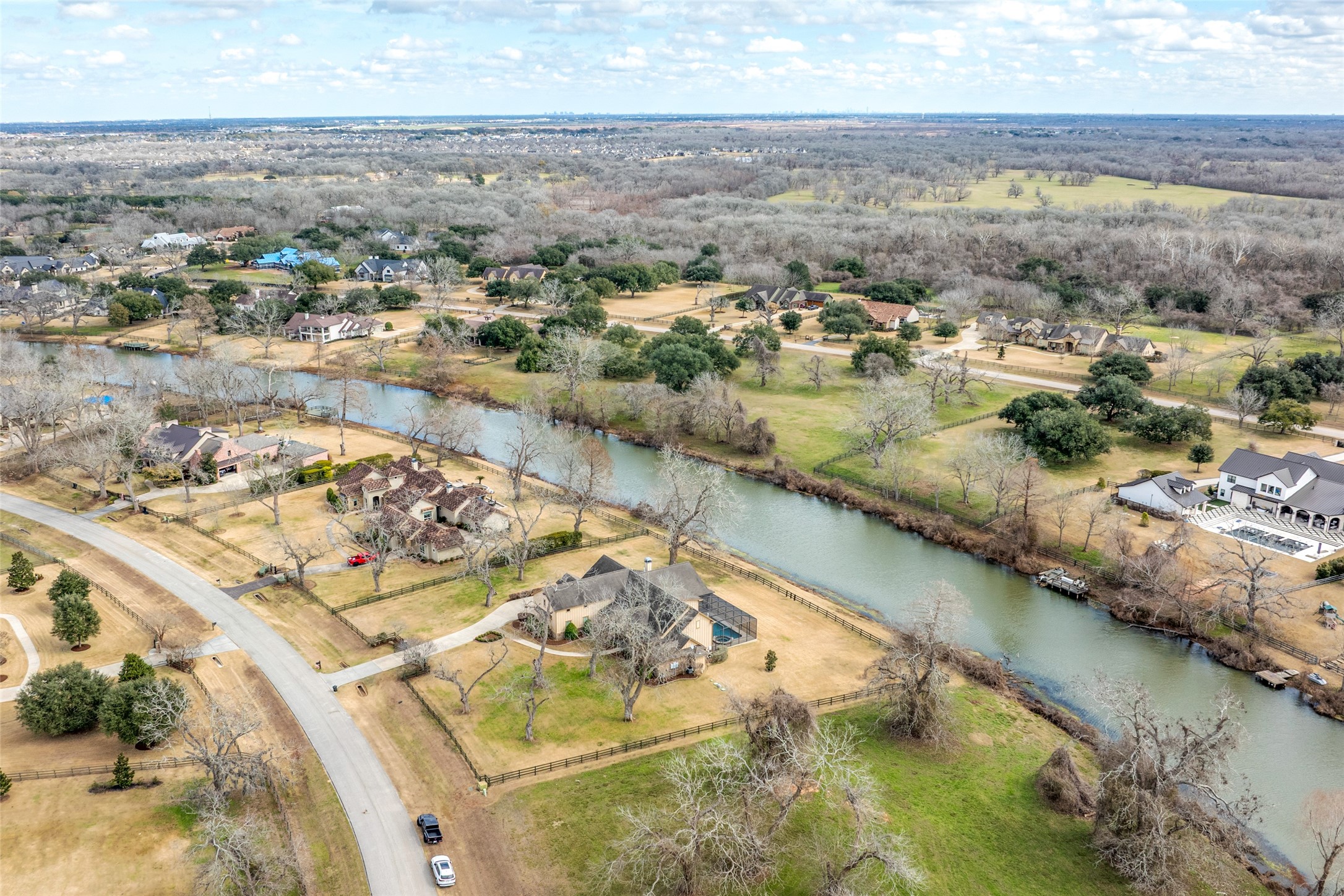 31102 Lower Oxbow Trace Fulshear, TX 77441 - Photo 46 of 50 an aerial view of residential houses with outdoor space