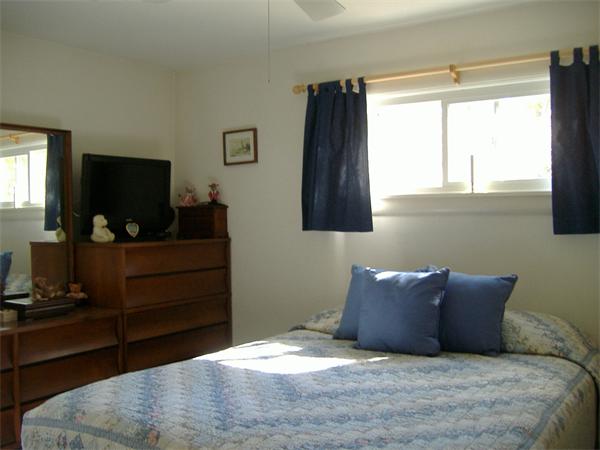 61 Hollis Road Lunenburg, MA 01462 - Photo 13 of 27 a large bed sitting in a bedroom next to a window and dresser